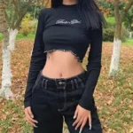 Long sleeve graphic crop top iwth raw or frayed hem under Serene suitcase