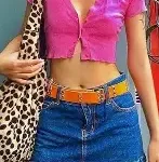 Pink crop top with mini skirt and leopard print bag under serene suitcase